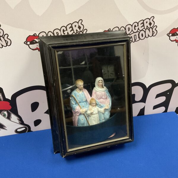 Vintage religious family display in glass case, porcelain figurines.