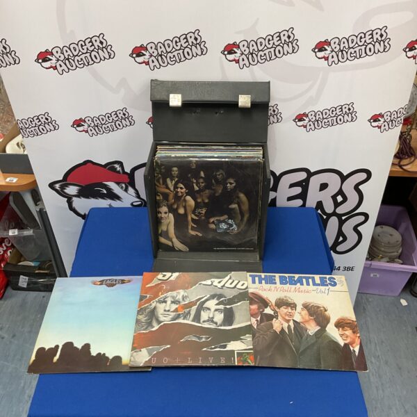 Vintage rock LP collection including The Eagles, Beatles, and Jimi Hendrix.