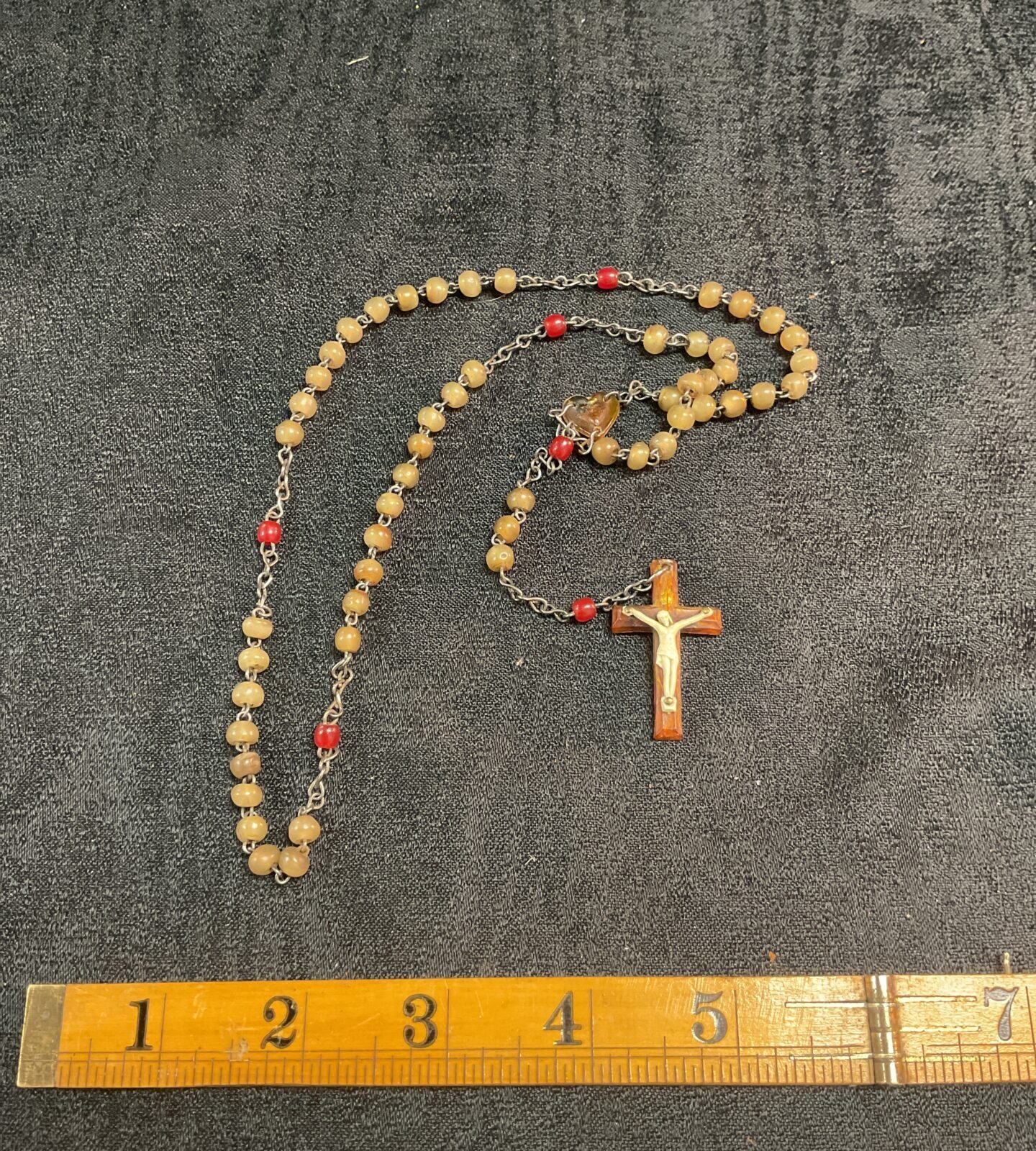 Vintage rosary beads with a detailed crucifix pendant.