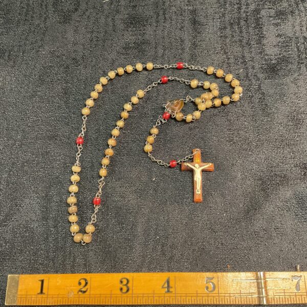 Vintage rosary beads with a detailed crucifix pendant.