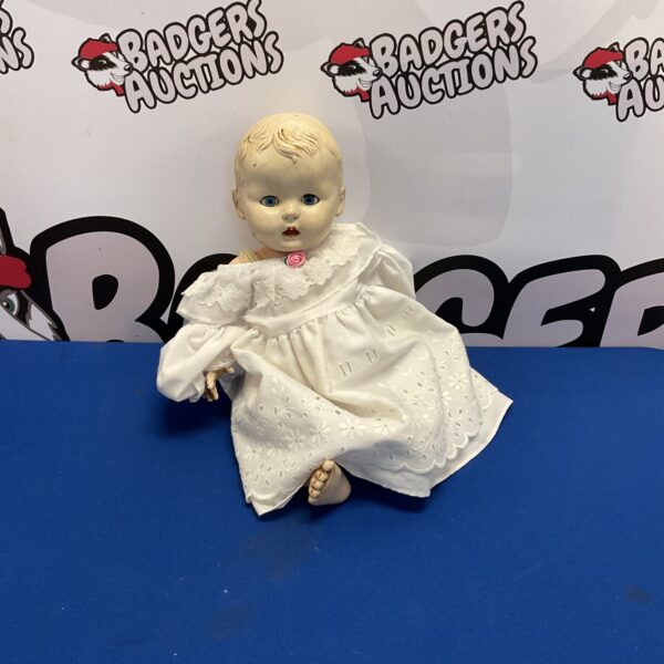 Vintage Rosebud doll in white lace dress, collectible antique toy.
