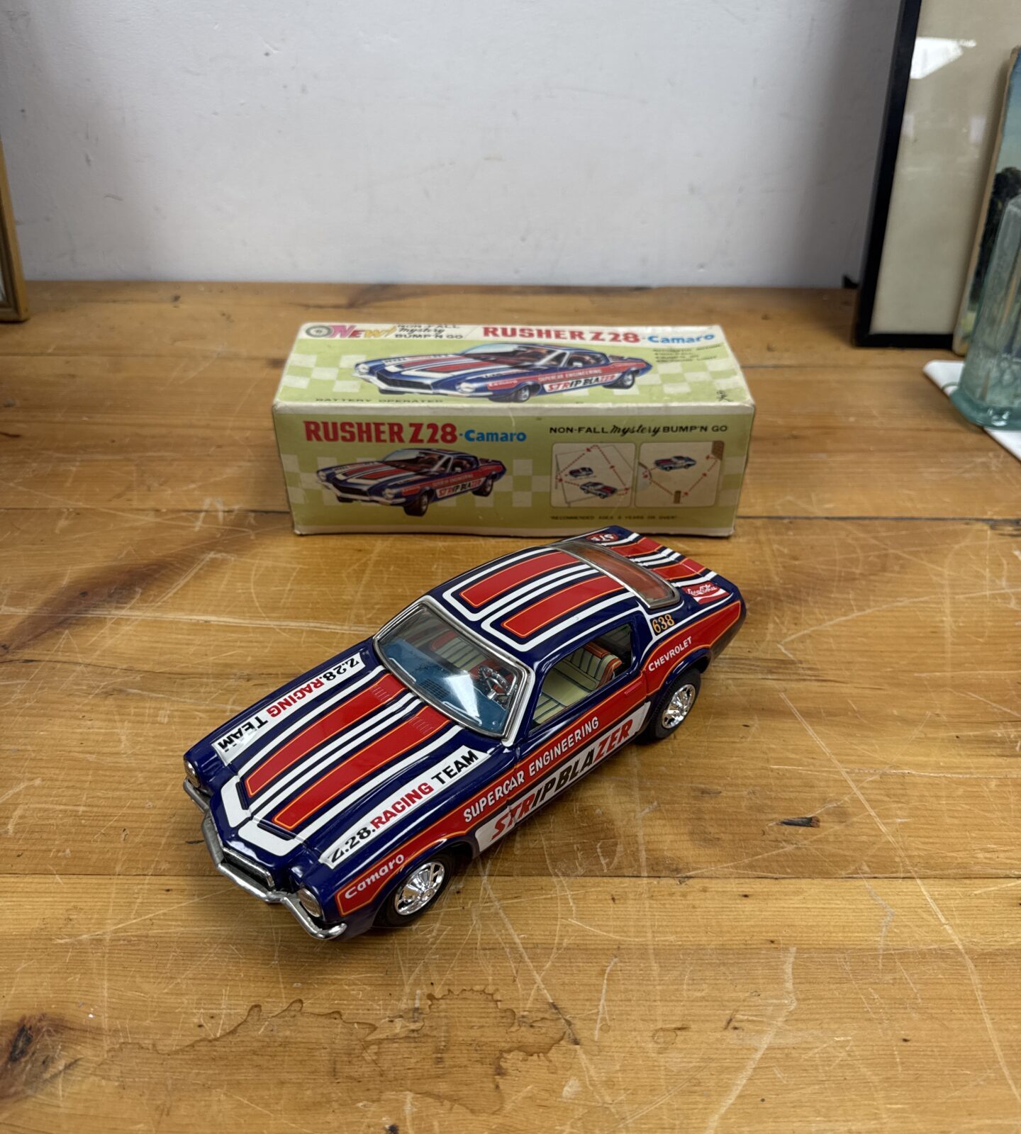 Vintage 1960s Rusher Z28 tin plate "Bump N Go" car in excellent condition.