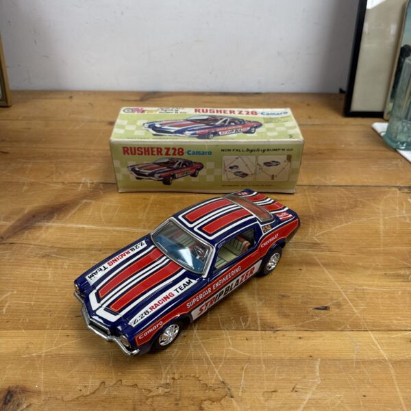 Vintage 1960s Rusher Z28 tin plate "Bump N Go" car in excellent condition.