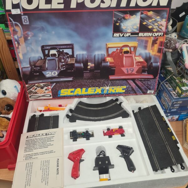 Vintage Scalextric race track set for miniature car racing.