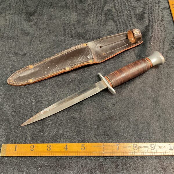 Vintage Sheffield stack leather knife with sheath.