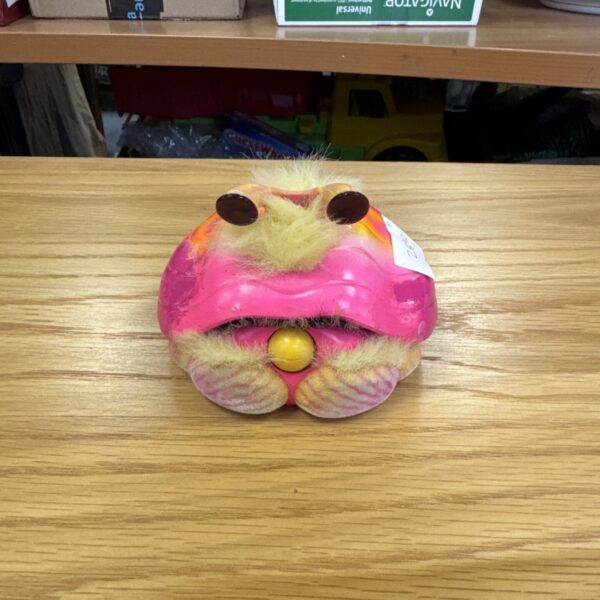 Full view of vintage Shellby interactive toy on a wooden surface.