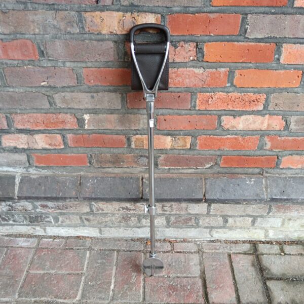 Vintage shooting stick with leather seat for game shooting.