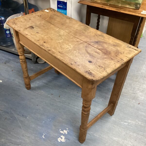 Vintage farmhouse side table with turned legs.
