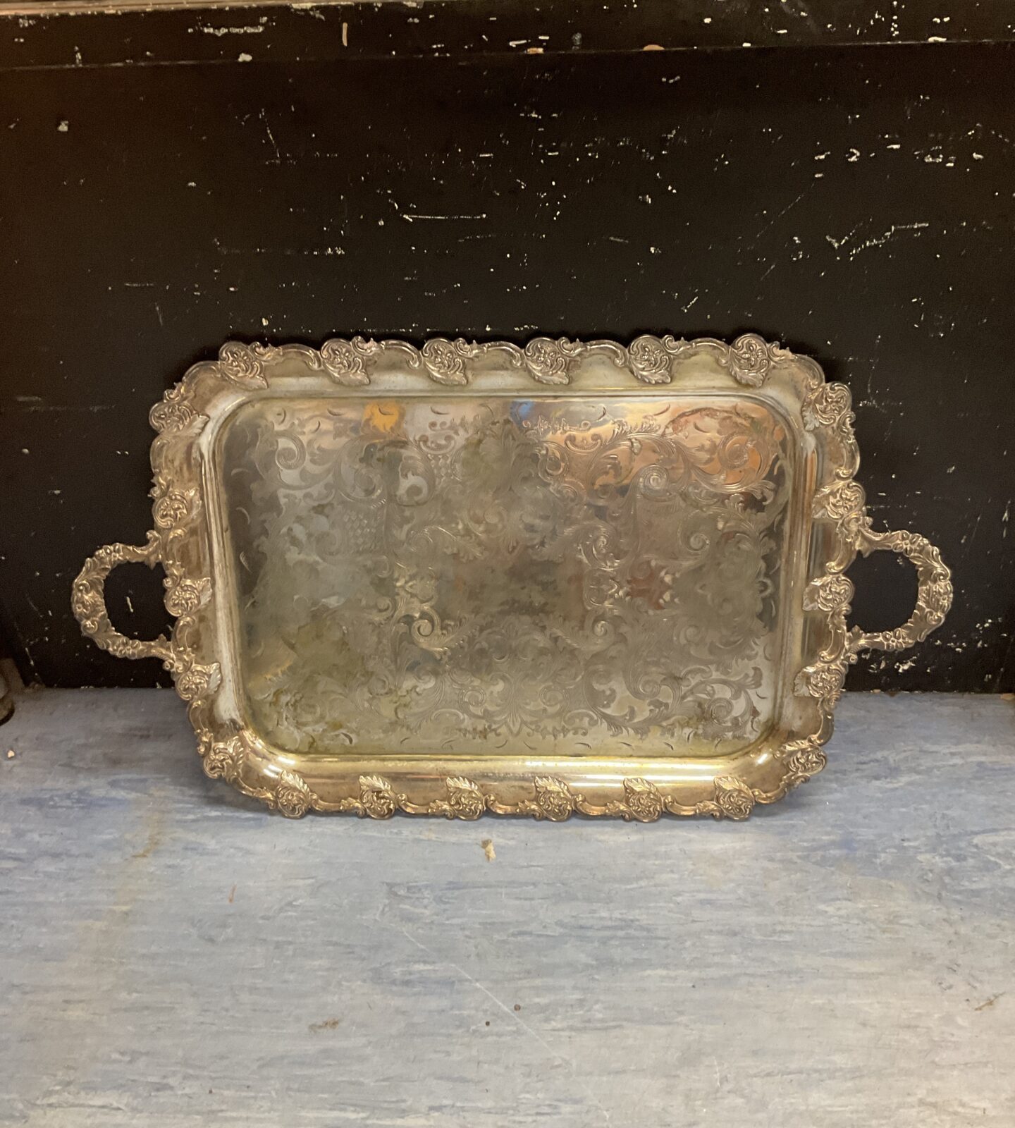 Ornate vintage silverplated tray with intricate detailing.