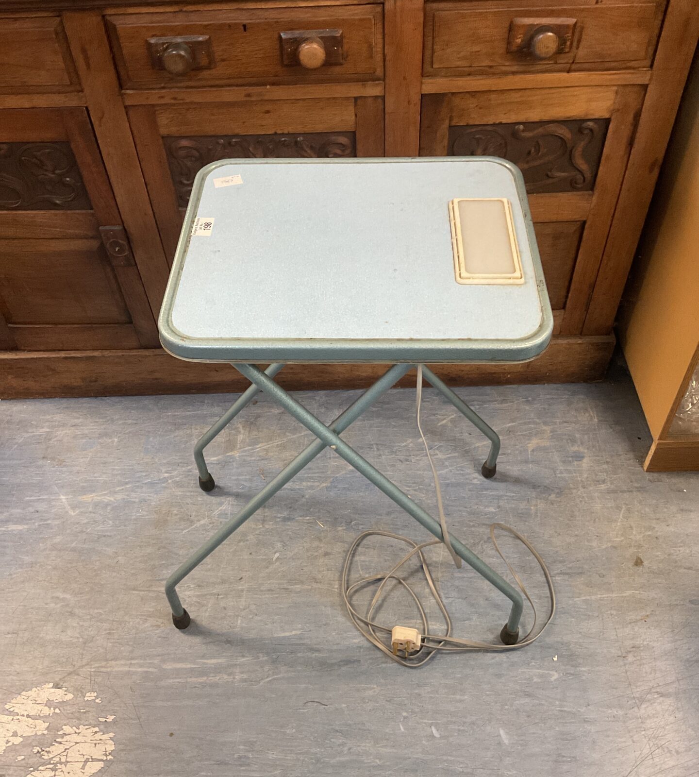 Vintage slide projector table with built-in lightbox for slide previewing.
