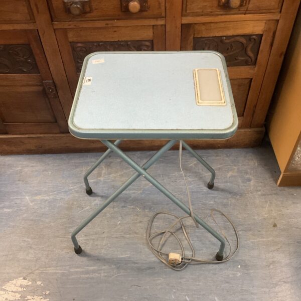 Vintage slide projector table with built-in lightbox for slide previewing.