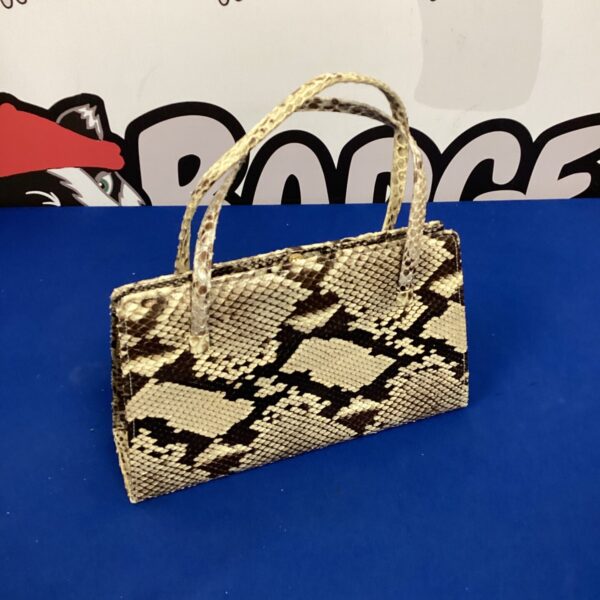 Vintage snake skin handbag with a natural reptile pattern.