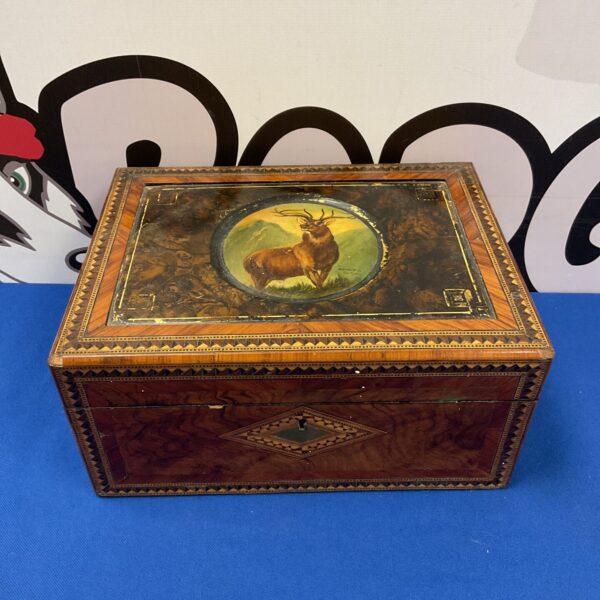 Vintage marquetry stationery box with Monarch of the Glen stag relief.
