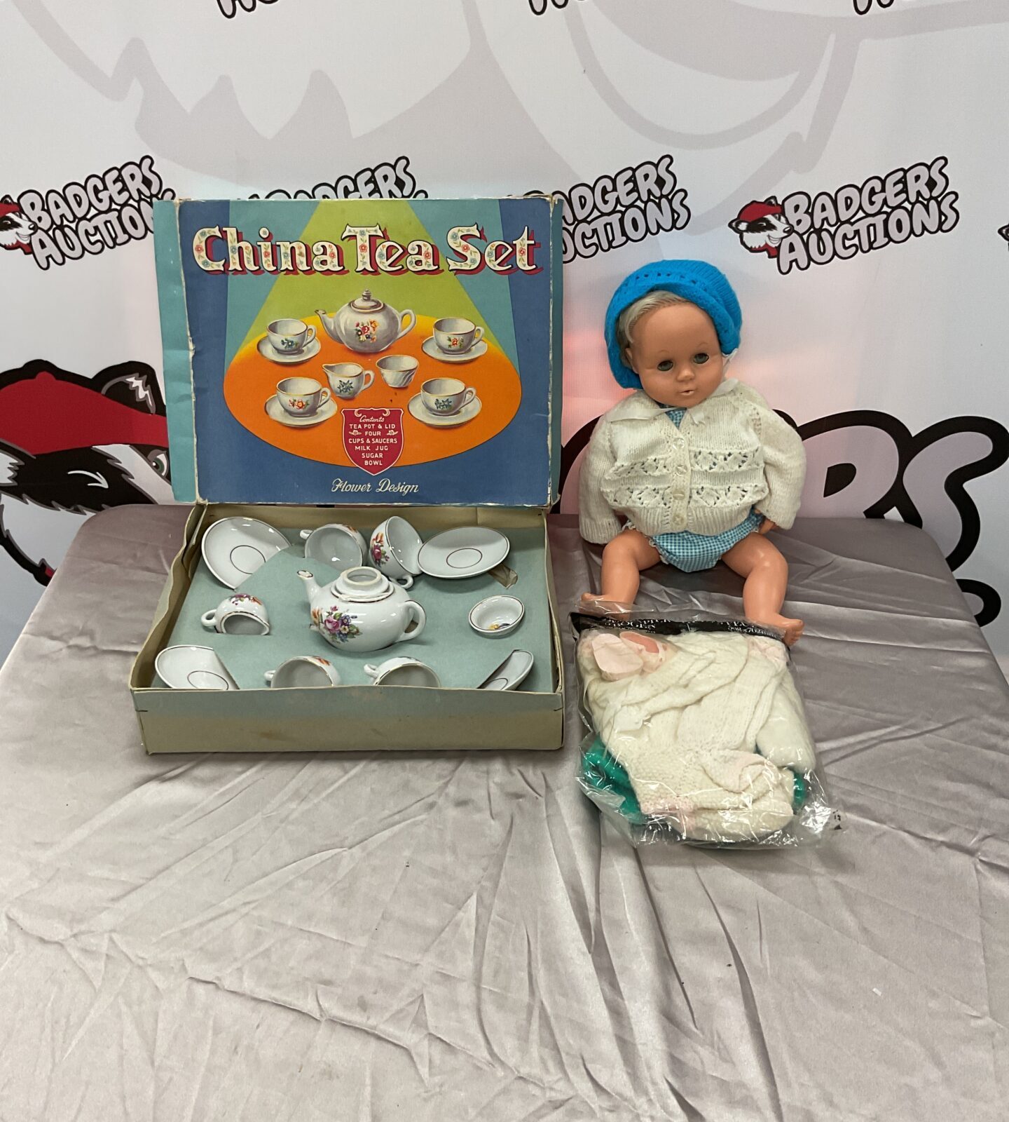 Vintage children's tea set with Tiny Tears doll, collectible toys.