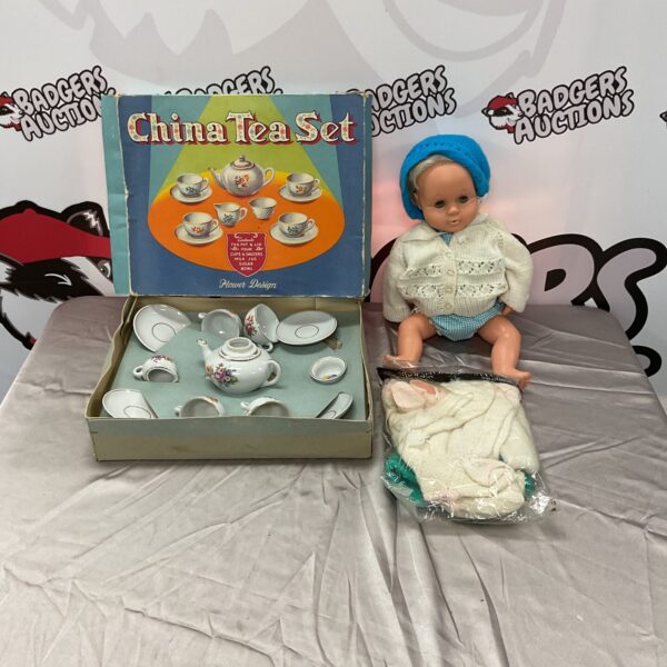 Vintage children's tea set with Tiny Tears doll, collectible toys.