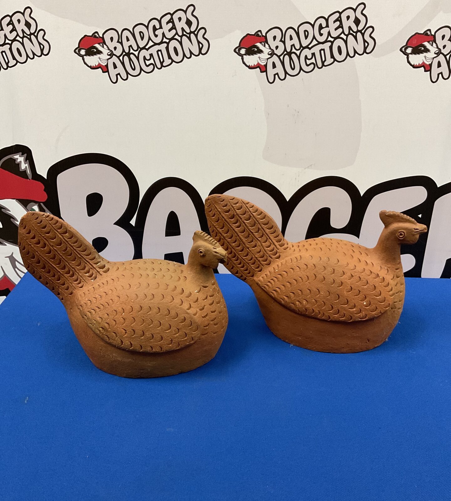Pair of vintage terracotta chickens for farmhouse decor.