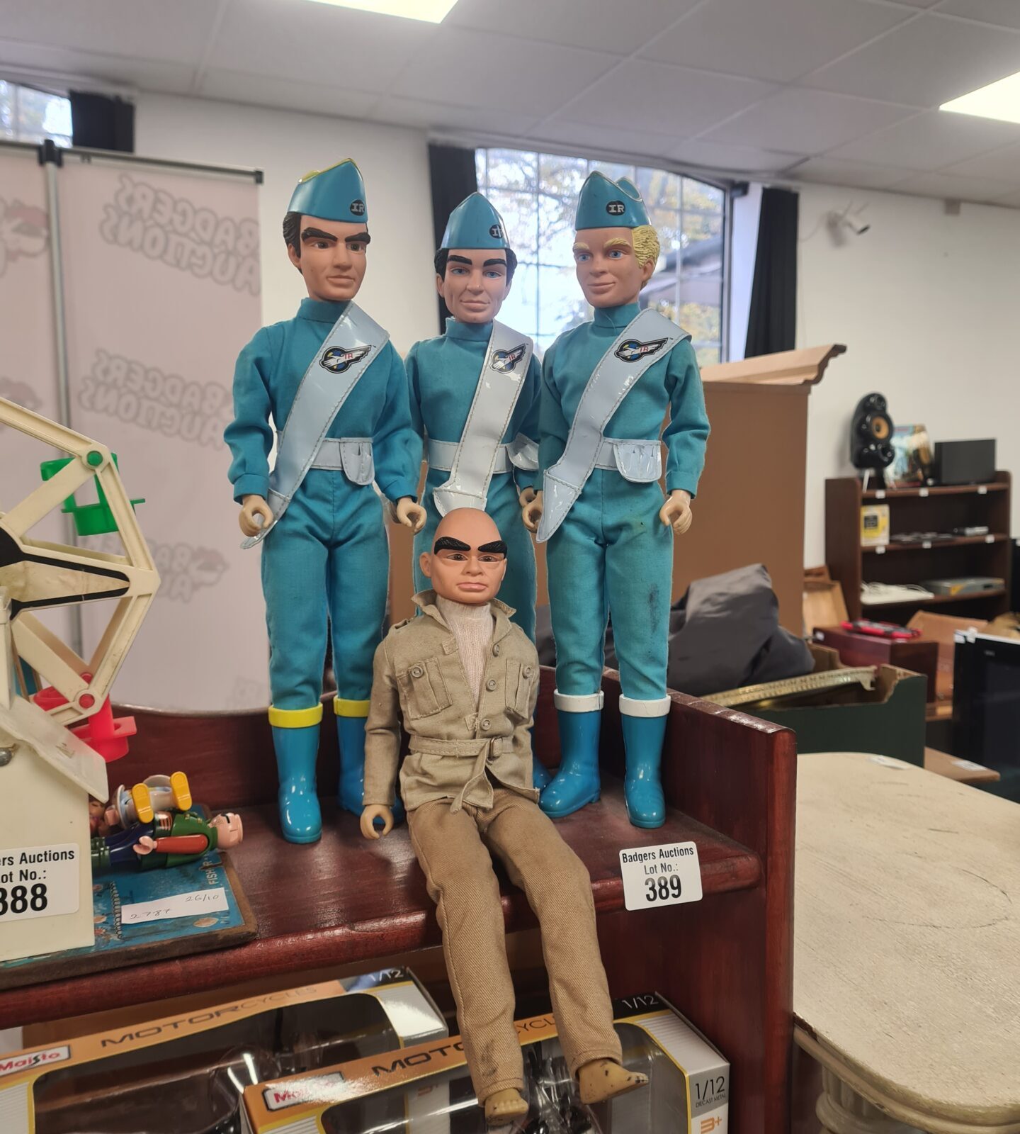 Group of four vintage Thunderbirds action figures from the 1960s.