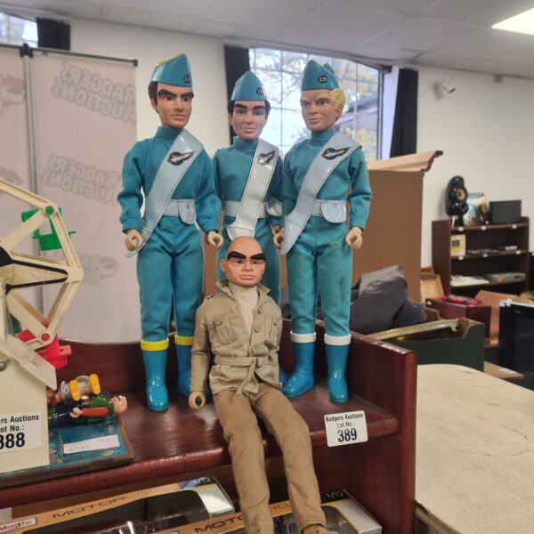 Group of four vintage Thunderbirds action figures from the 1960s.