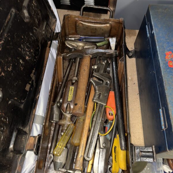 Vintage tool lot inside a military ammunition crate, antique hand tools.