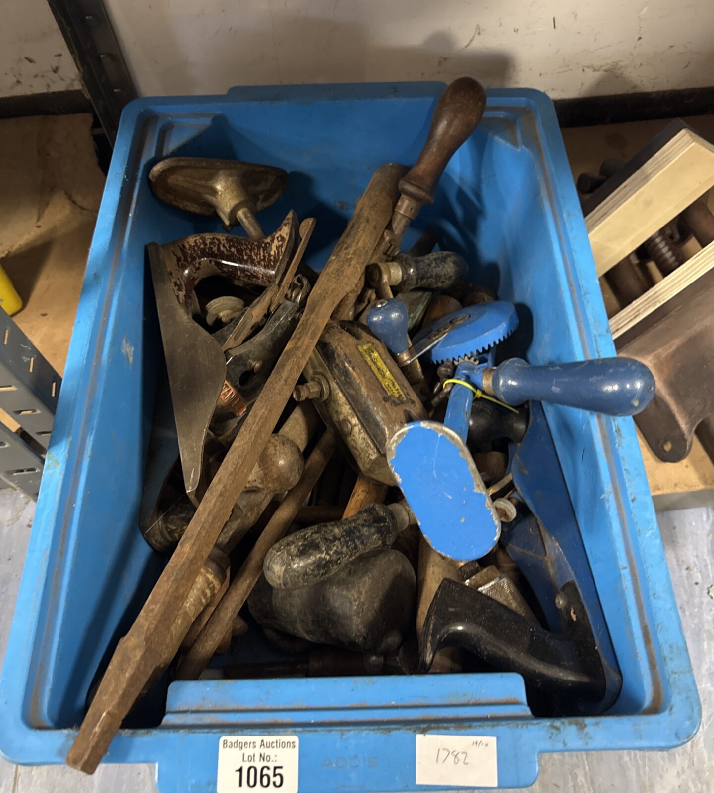 Vintage tools lot including wood planes and a drill brace.