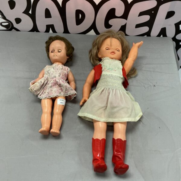 Vintage toy dolls lot with pink dresses and red boots.