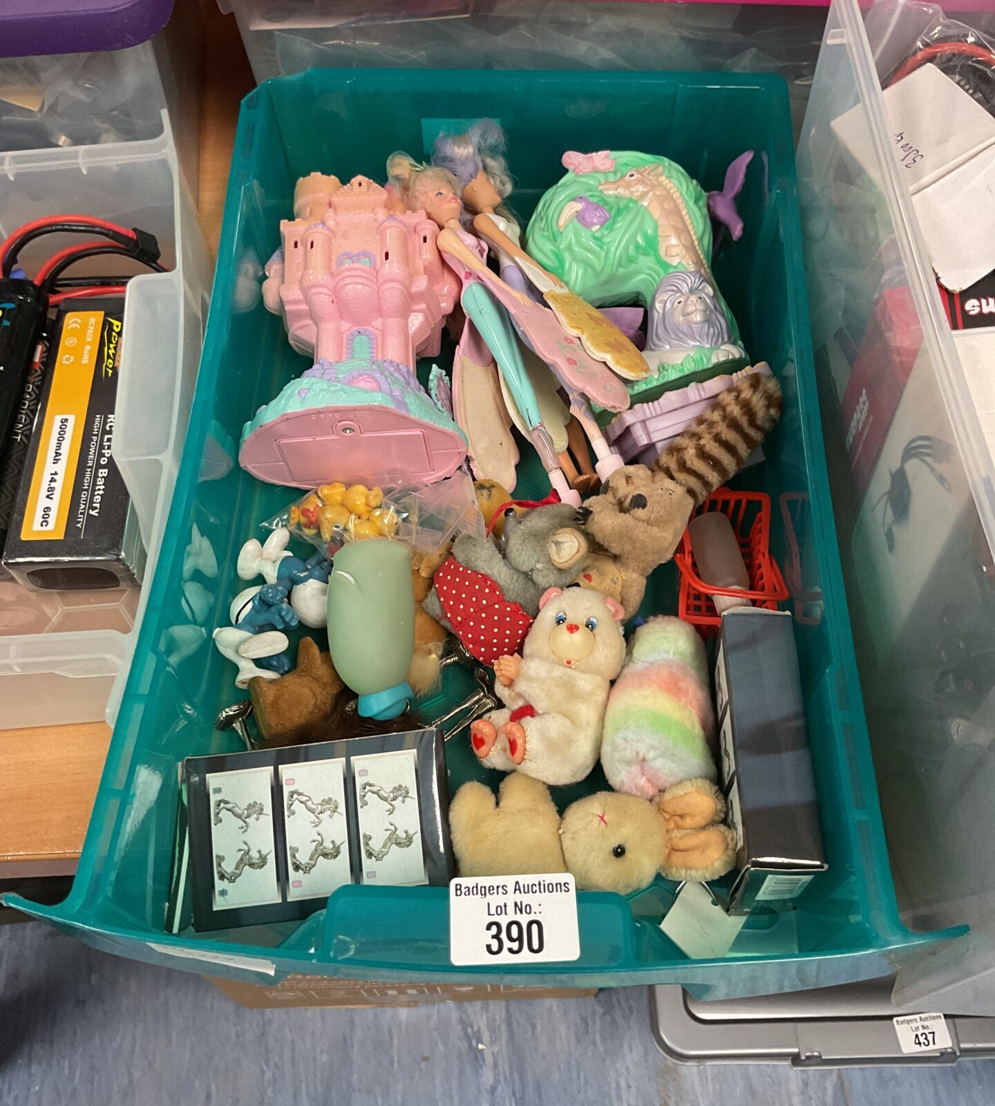 Vintage toy lot featuring Care Bears and flying fairies.