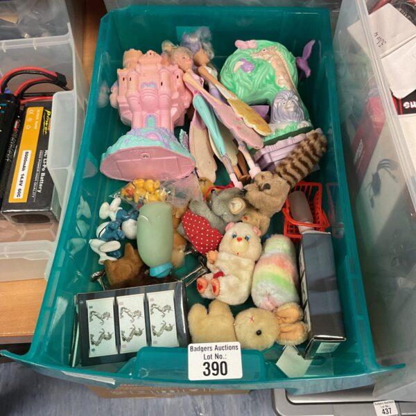 Vintage toy lot featuring Care Bears and flying fairies.