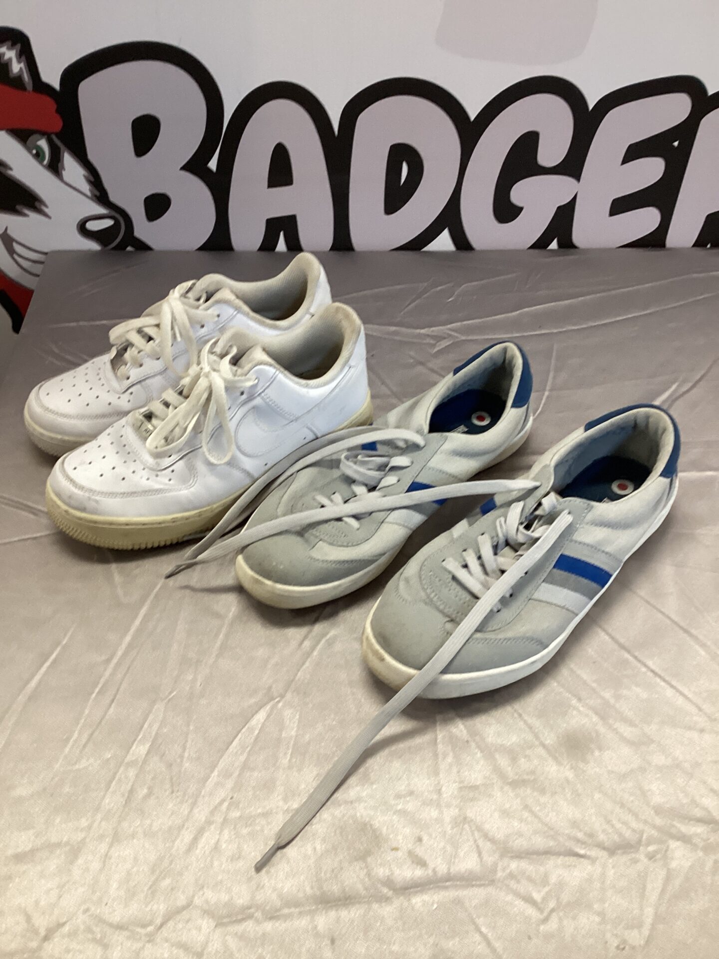 Pair of vintage Nike and Lambretta trainers for collectors.