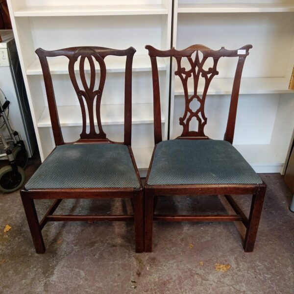 Pair of vintage tulip back dining chairs with wood frames.