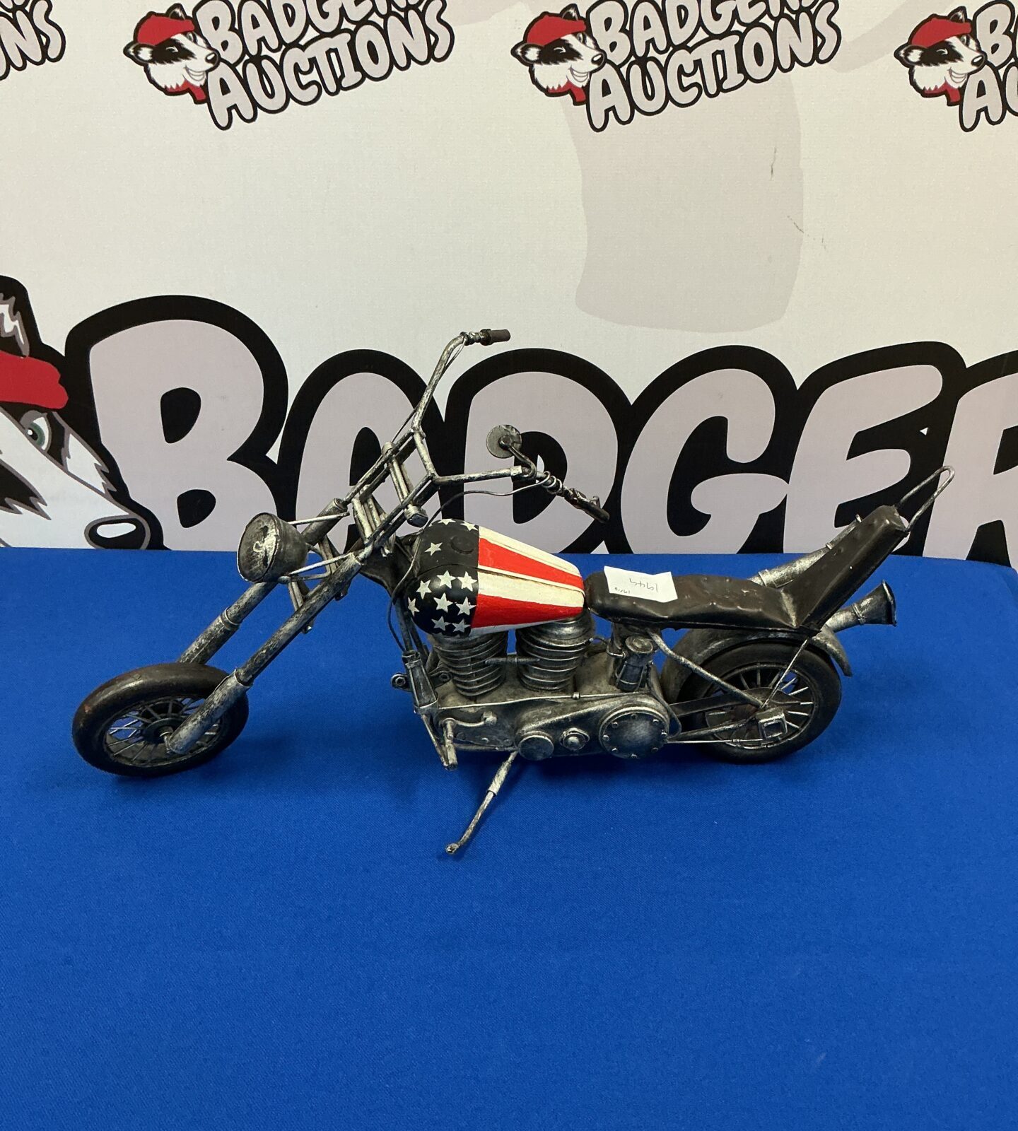 Detailed vintage USA chopper motorcycle model on display.