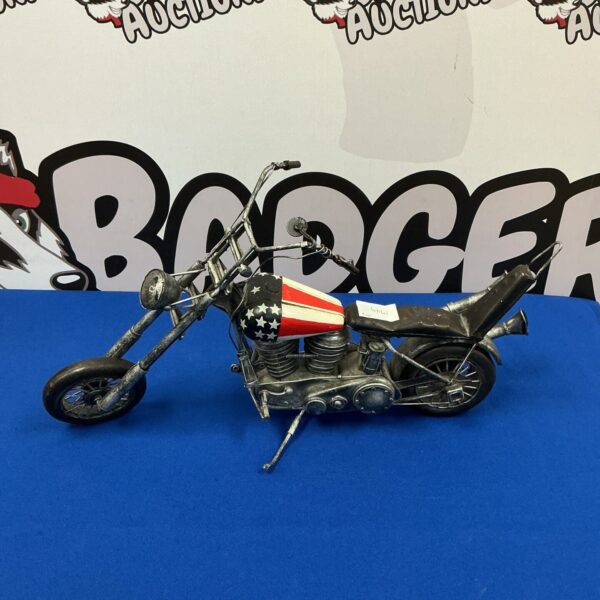 Detailed vintage USA chopper motorcycle model on display.