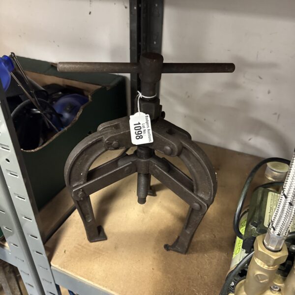Vintage valve puller tool for engine or plumbing repair.