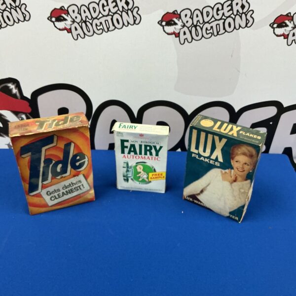 Vintage Tide and Fairy washing powder boxes, retro laundry packaging.