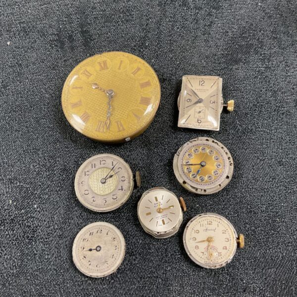 Lot of seven vintage watch movements for repair or collection.