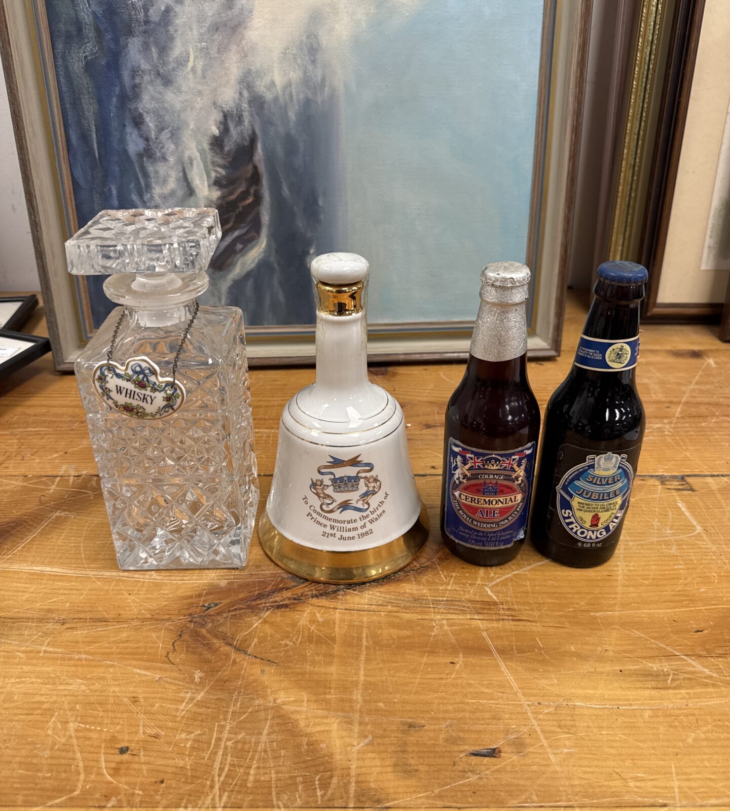 Vintage whisky decanter, Bells bell, and sealed ale bottles set.