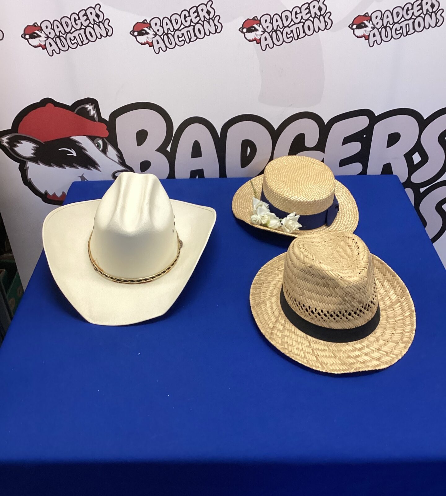 Pair of vintage wicker boating hats with cowboy style brims.