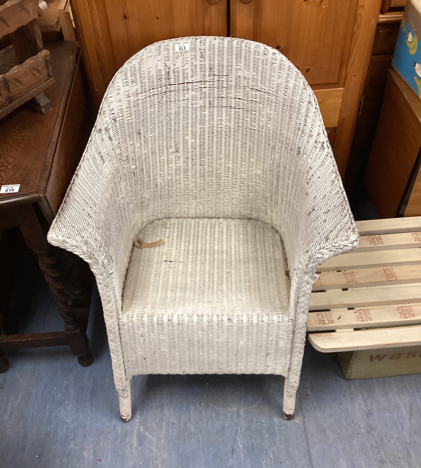 Vintage wicker chair with a classic woven design.
