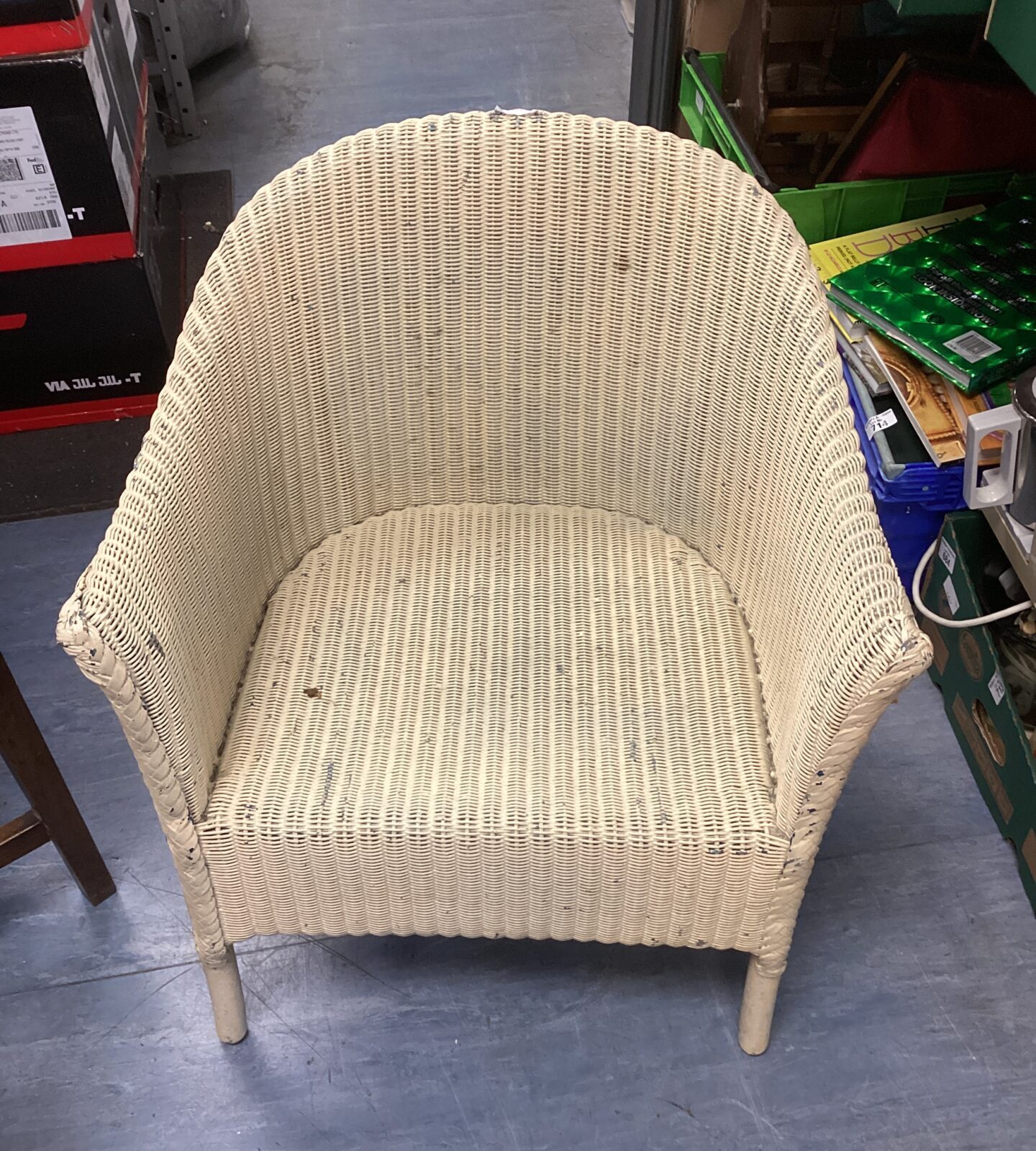 Small vintage wicker chair with a classic design.