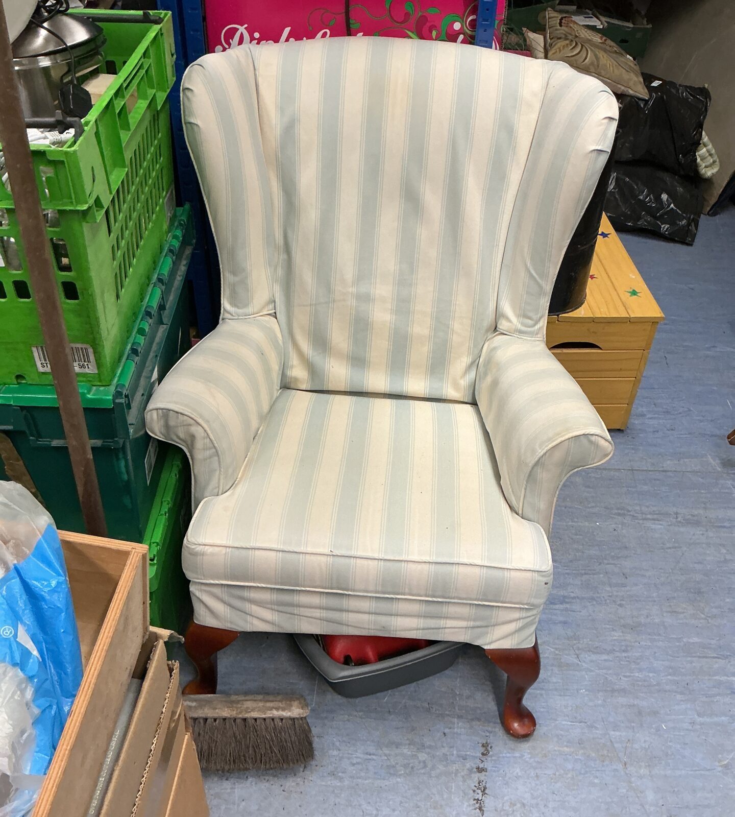 Vintage patterned wingback armchair, classic mid-century style.