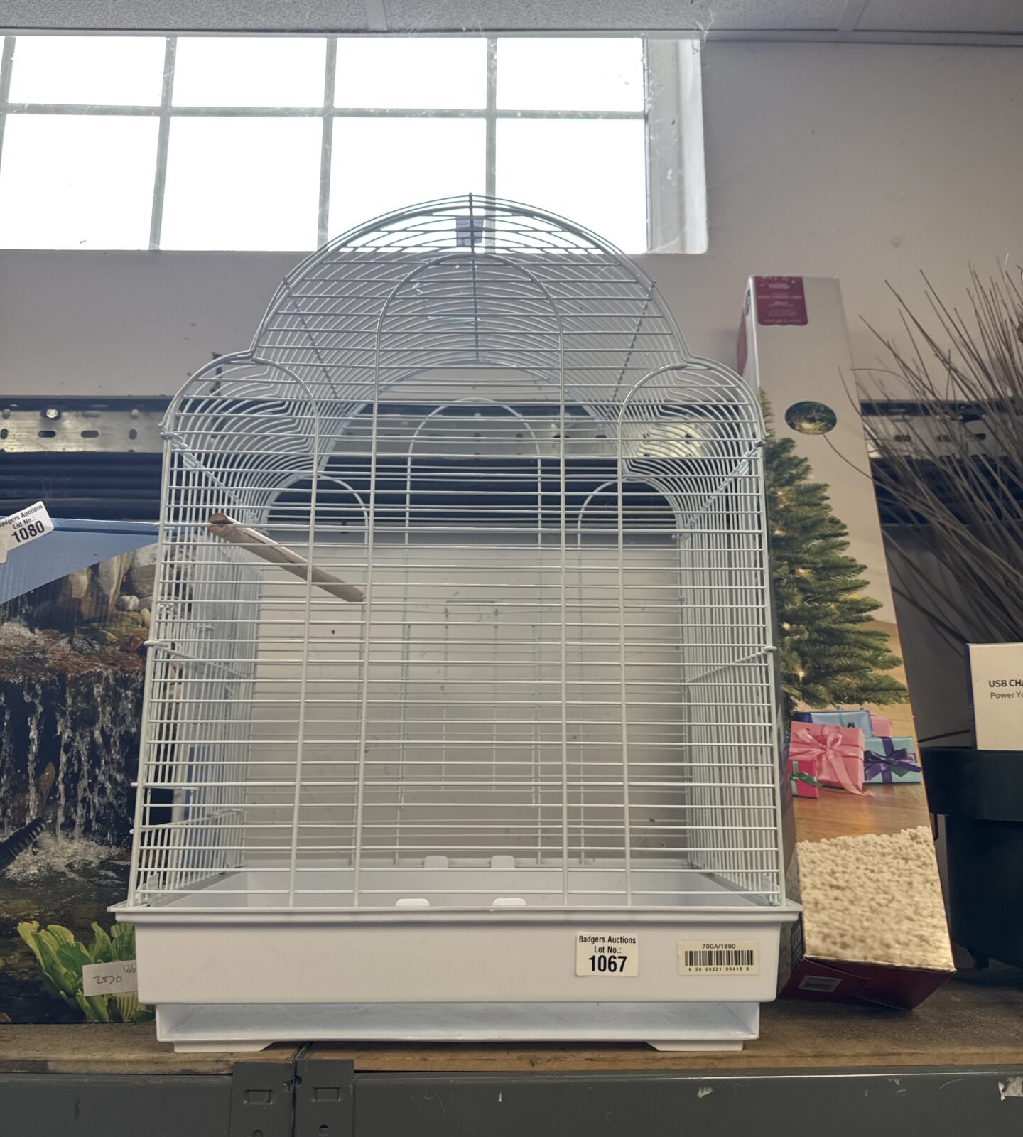 Vintage wire bird cage with a classic rounded design.