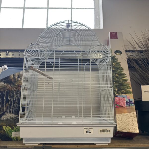 Vintage wire bird cage with a classic rounded design.