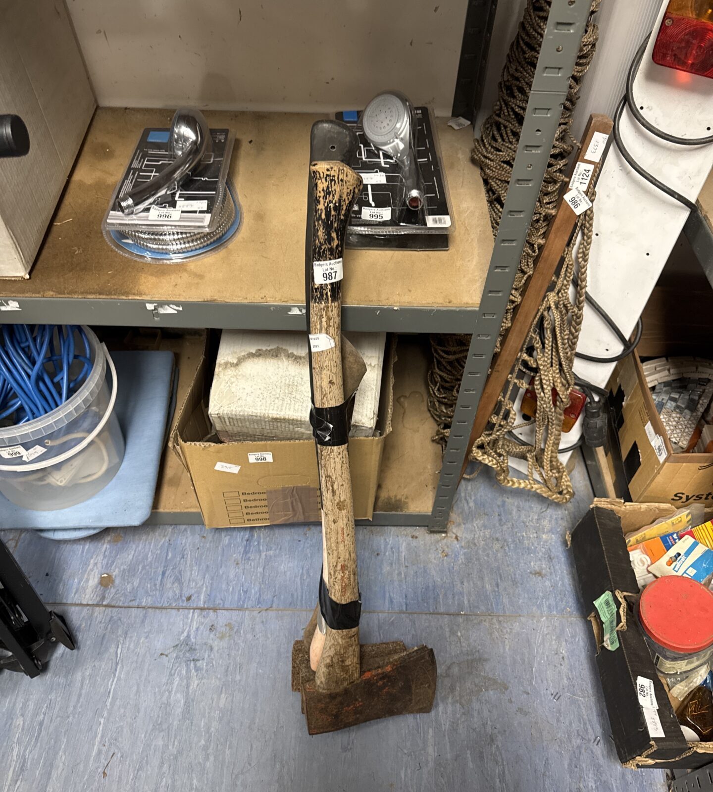 Vintage wood axe with a steel head and wooden handle.