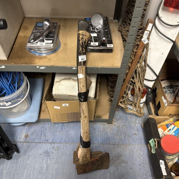 Vintage wood axe with a steel head and wooden handle.