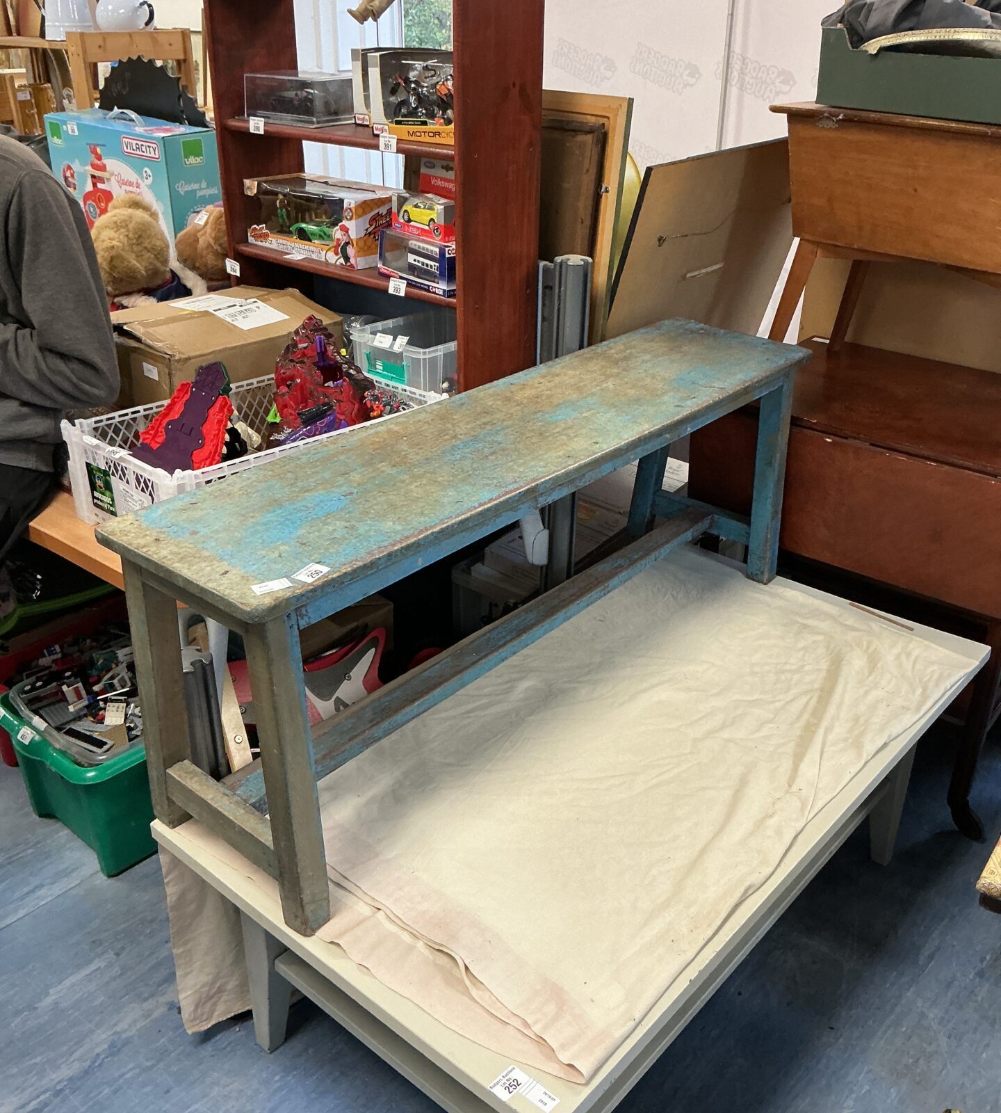 Rustic vintage wooden bench with weathered patina, ideal for farmhouse style.