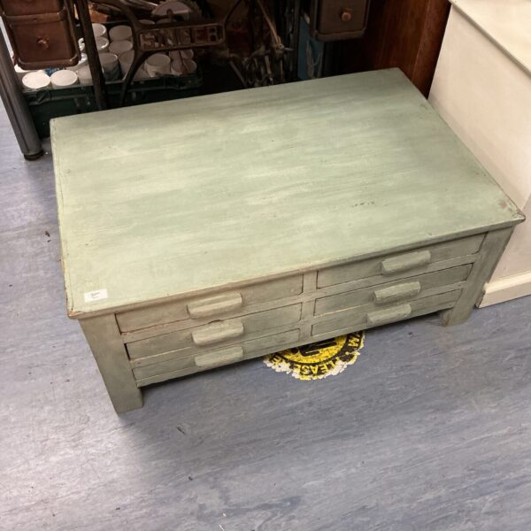 Vintage wooden drawer unit with multiple drawers for storage.