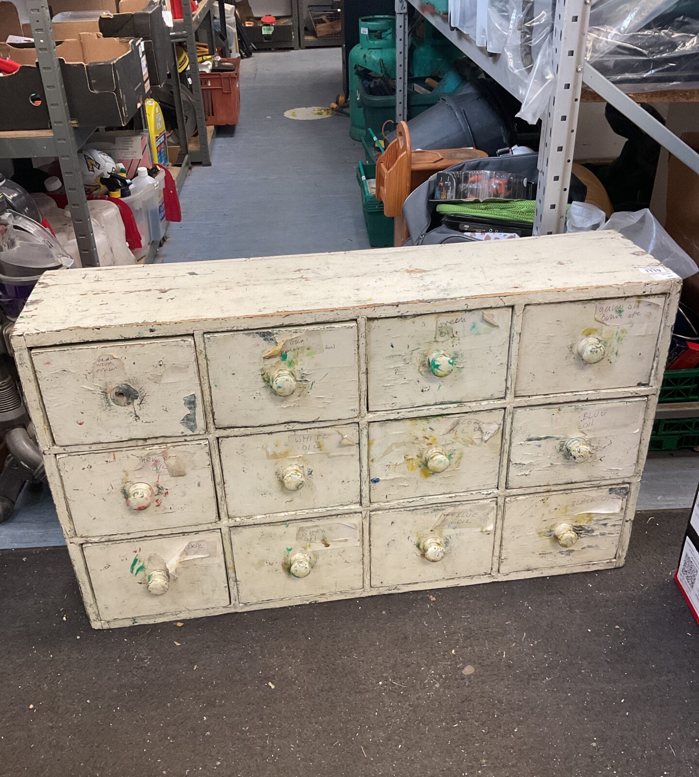 Vintage wooden pigeon hole cabinet with multiple compartments.
