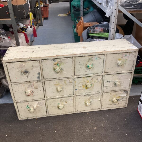 Vintage wooden pigeon hole cabinet with multiple compartments.