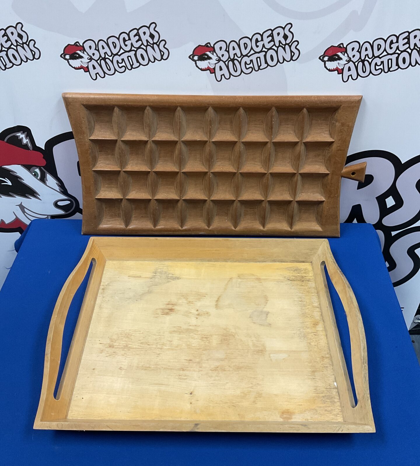 Vintage wooden serving tray with raised edges for serving.