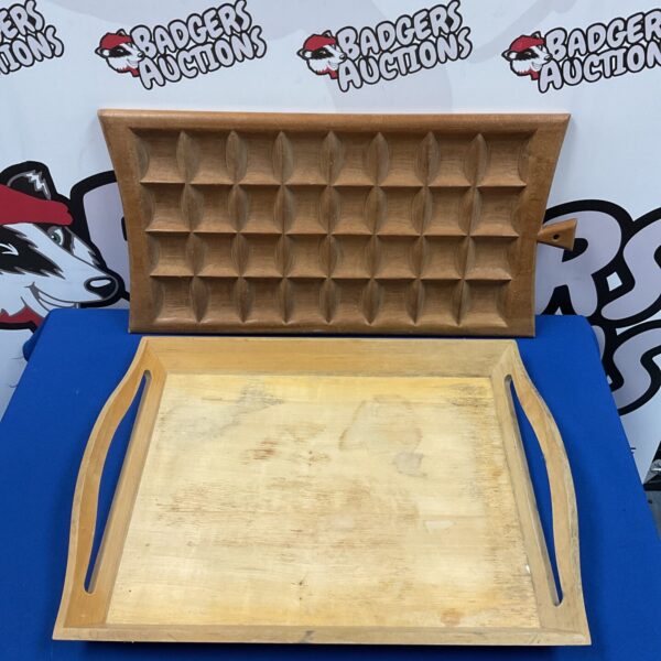 Vintage wooden serving tray with raised edges for serving.
