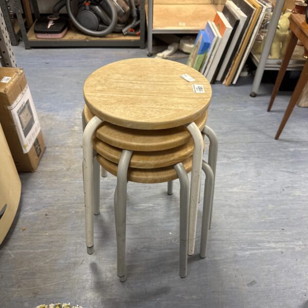 Stack of four vintage wooden topped stools with chrome legs.